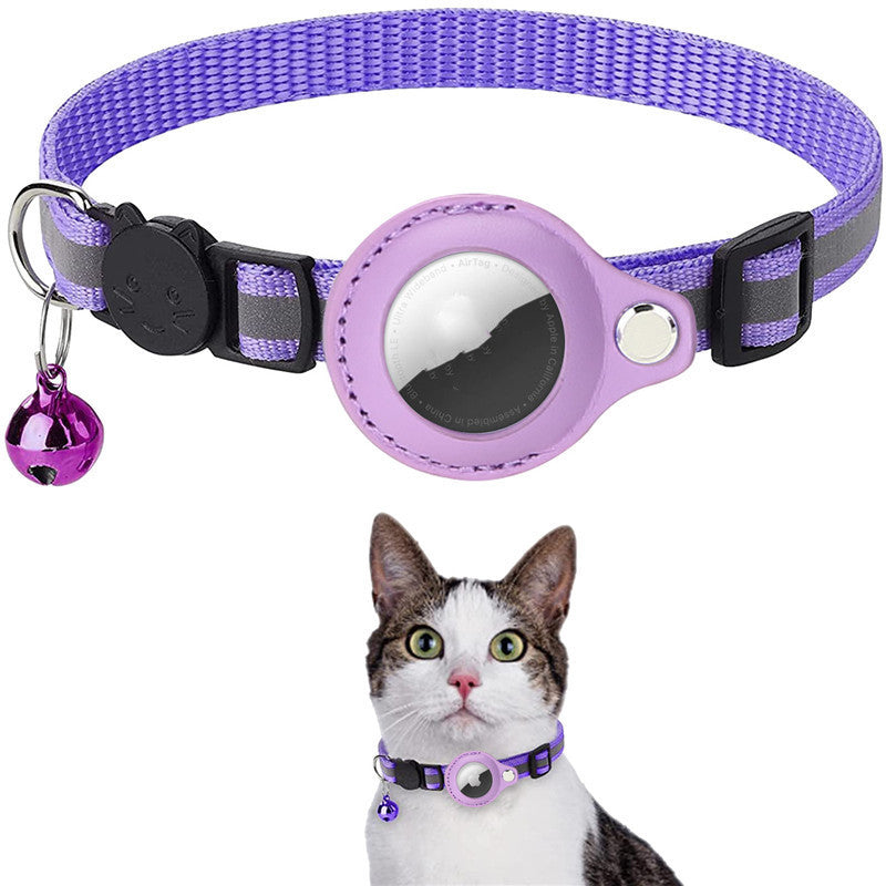 Purple pet collar with bell and reflective patch on a white background